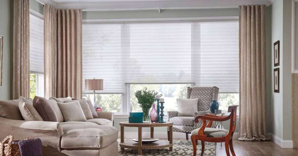 Layering cellular shades with curtains is a simple yet impactful way to enhance the beauty and functionality of your home.