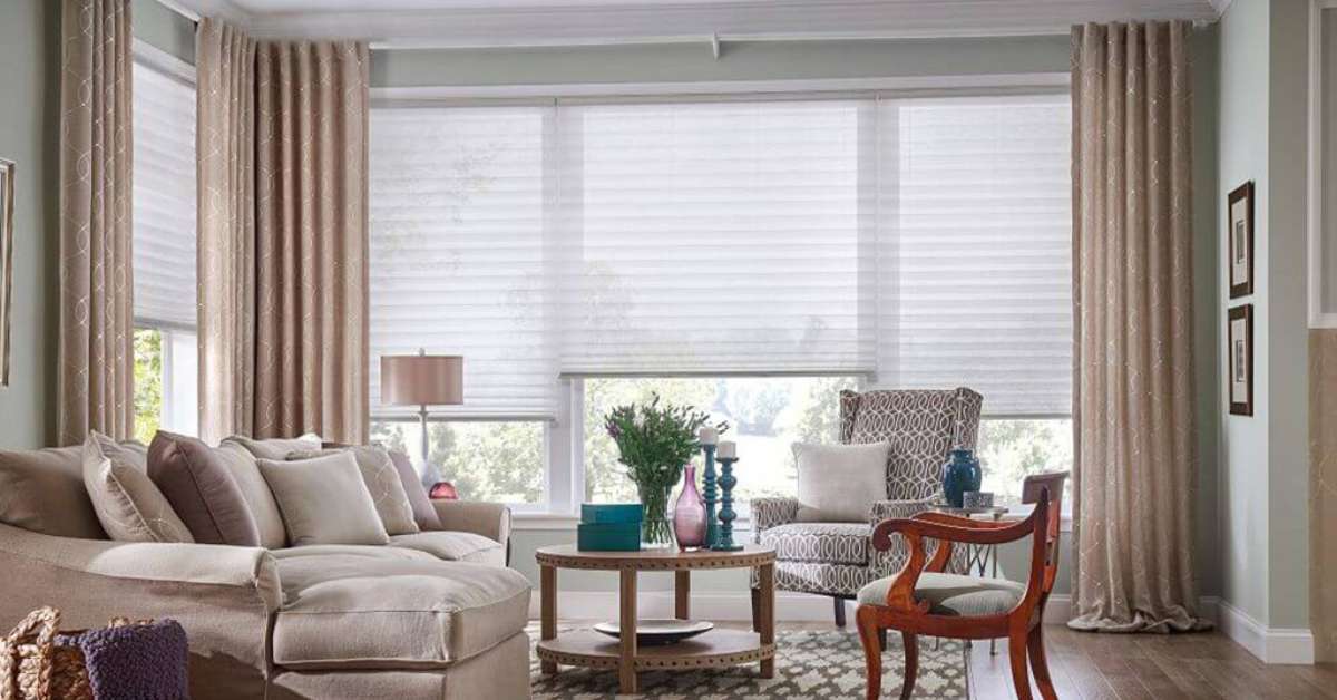 Layering cellular shades with curtains is a simple yet impactful way to enhance the beauty and functionality of your home.