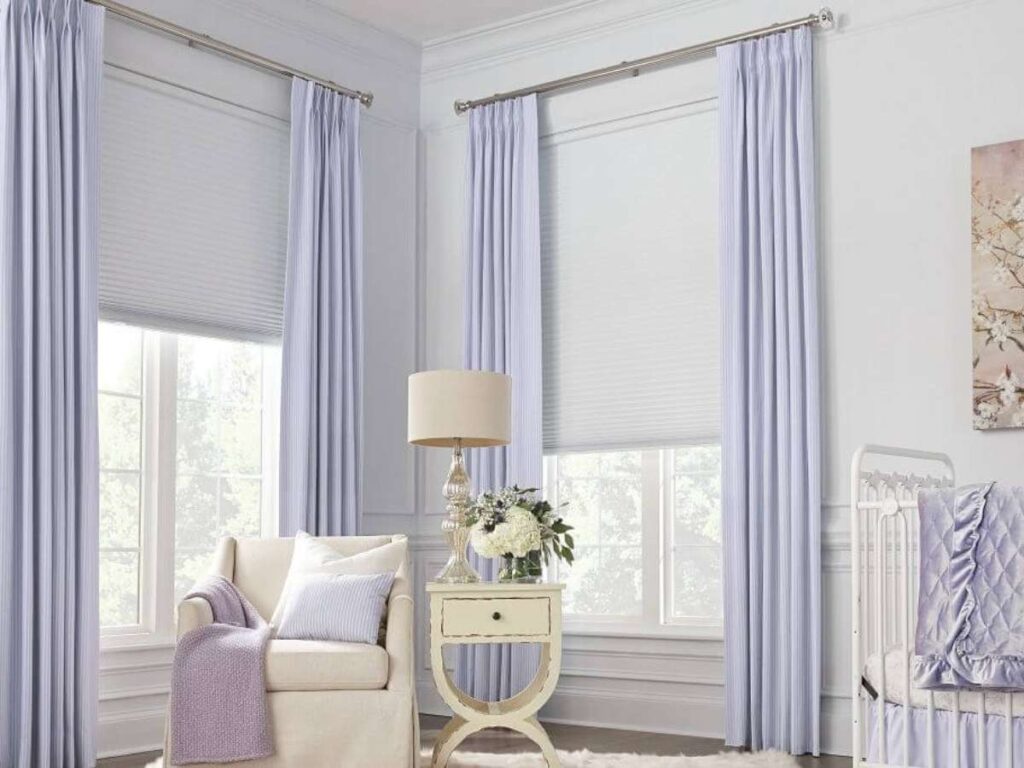 Create a Cozy Retreat: Layer Cellular Shades with Curtains 1 Layered window treatments allow for versatile light control.